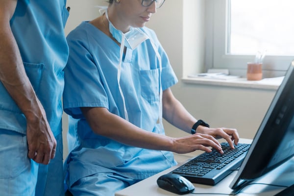 close-up-of-doctors-logging-order-for-client-details