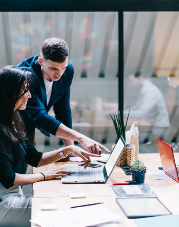 business-colleages-studying-laptop-screen