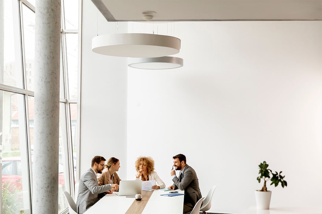 business-team-collaborating-at-conference-table-in-modern-office