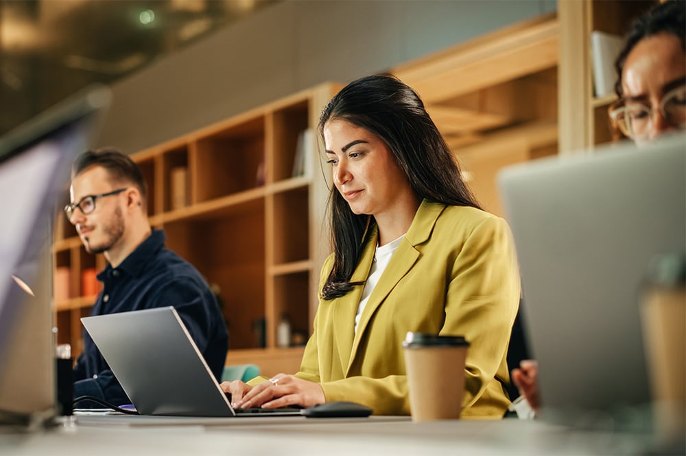 diverse-professionals-in-office-diligently-working