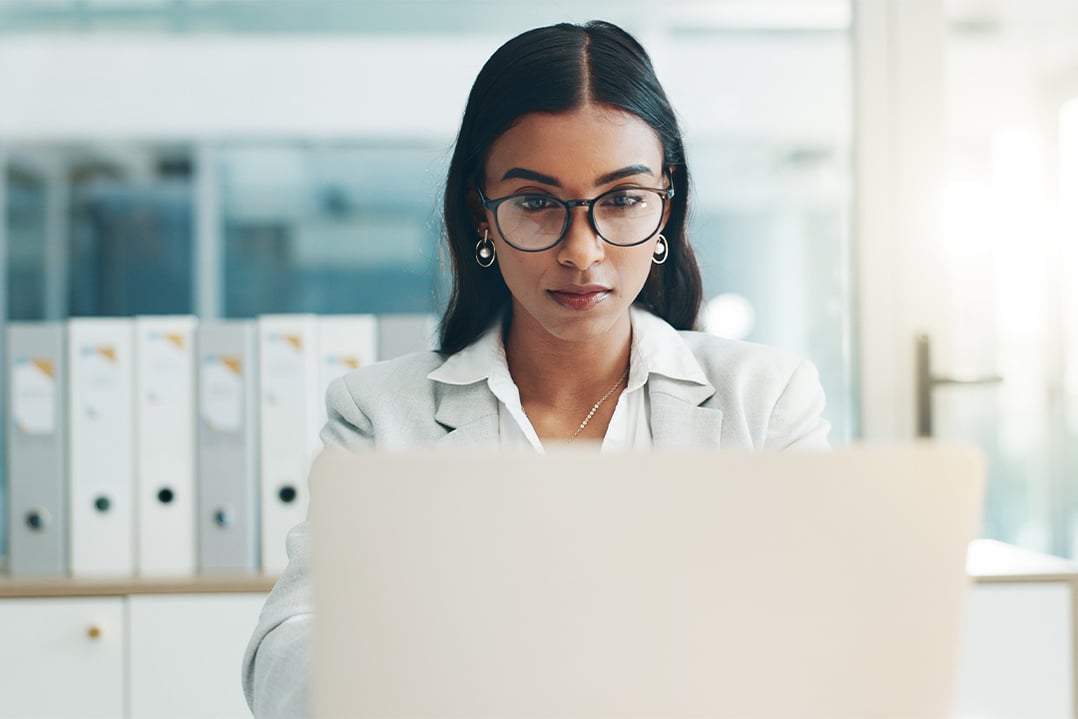 female-business-professional-in-office-researching-data