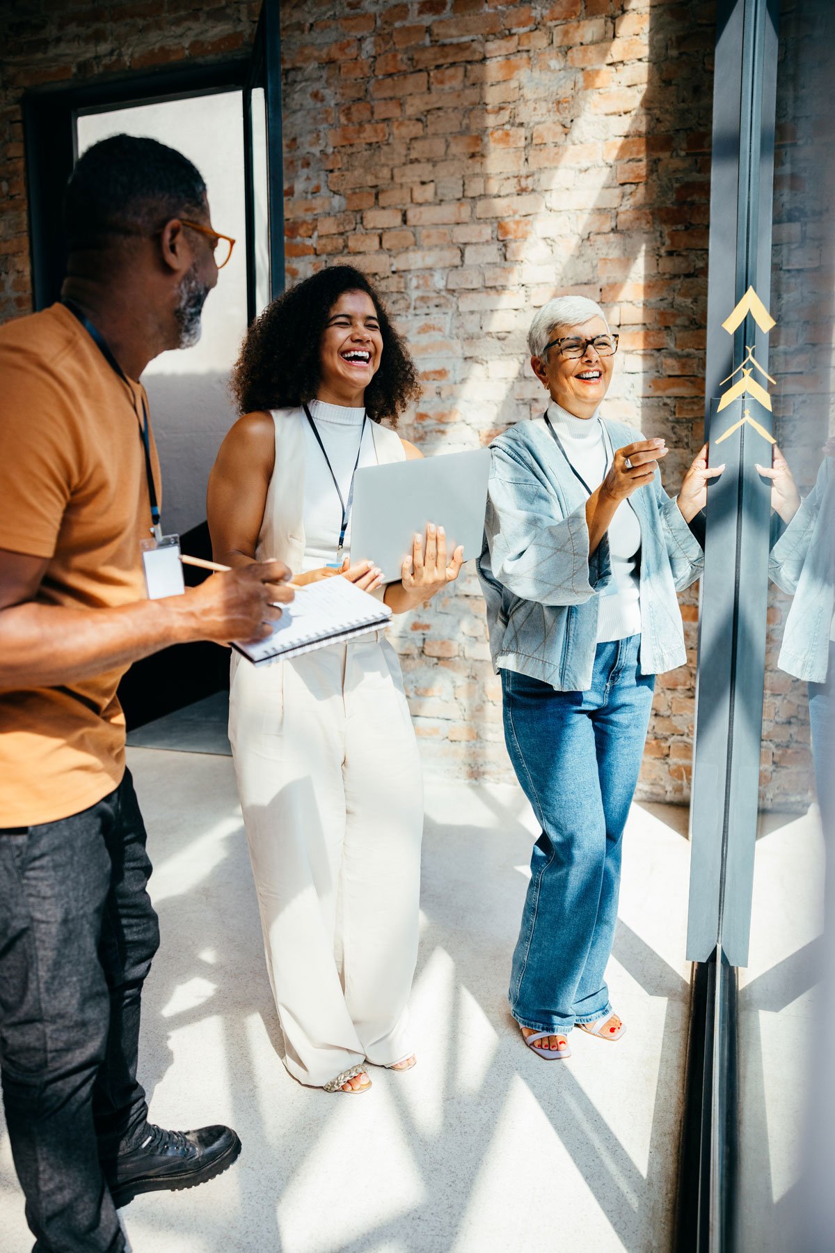 three-co-workers-colaborating-together