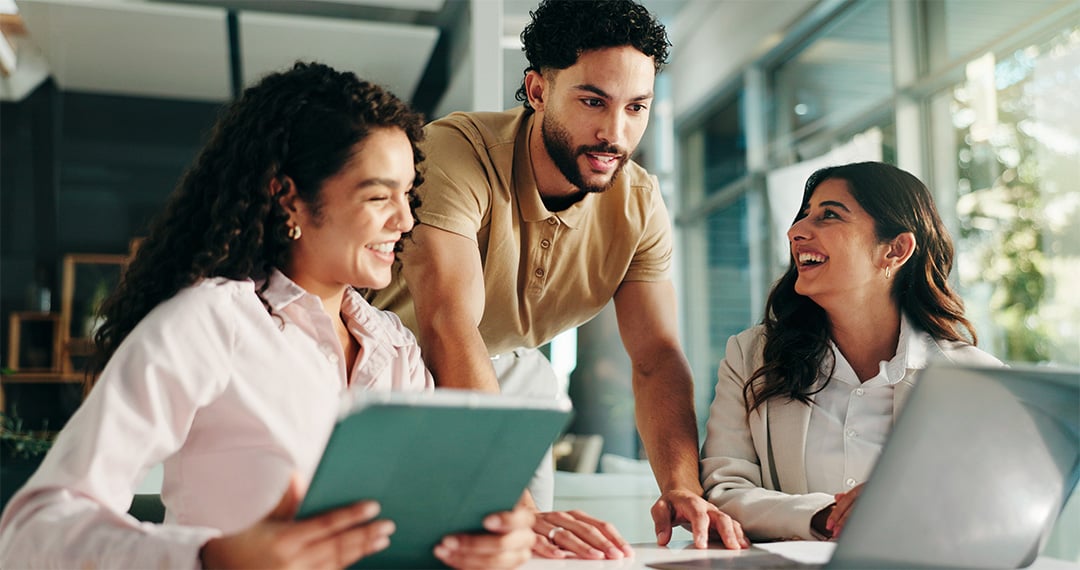 business-team-collaborating-with-laptop-and-tablet