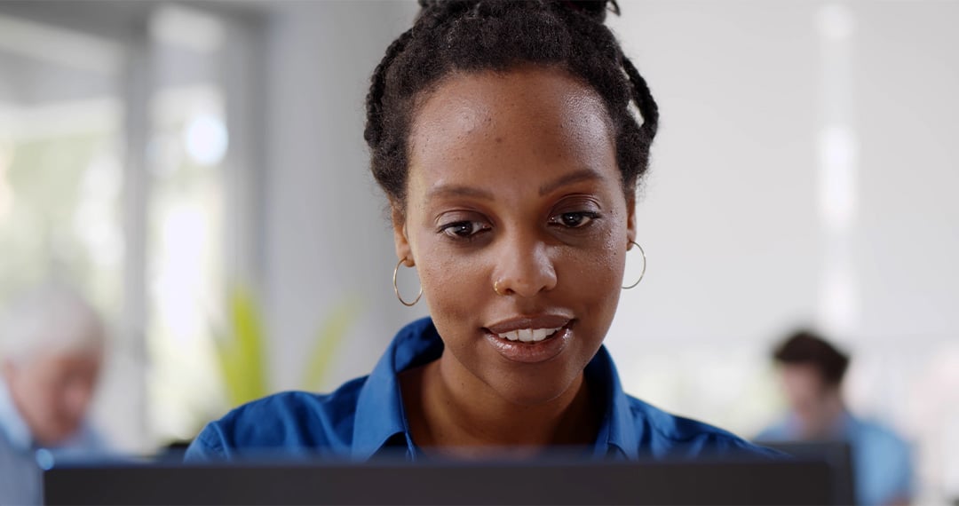 female-employee-looking-at-monitor-in-office